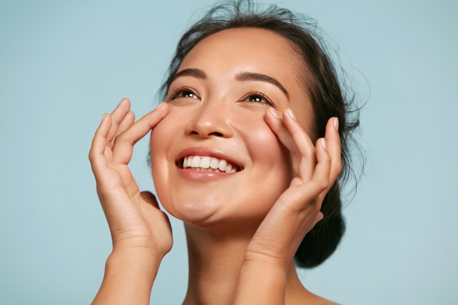 Smiling woman with clear, glowing skin — Neoderma Advanced Skin Care, Anaheim