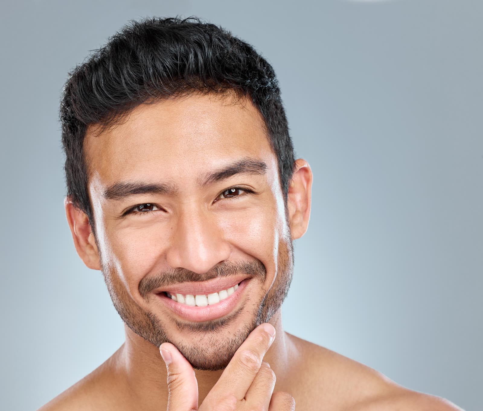 Smiling man with healthy skin — Neoderma treatments financed with the CareCredit health and wellness credit card
